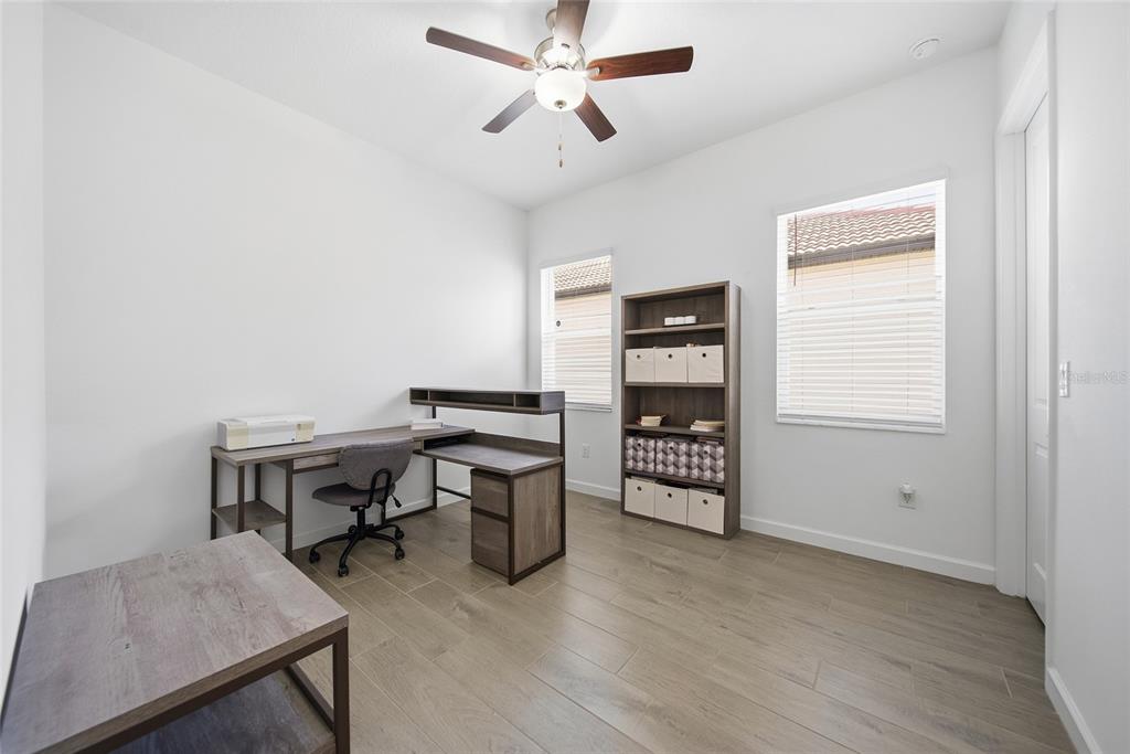 17301 Scuba Crest Street Wimauma, FL 33598 - Photo 16 of 37 a view of a workspace with furniture