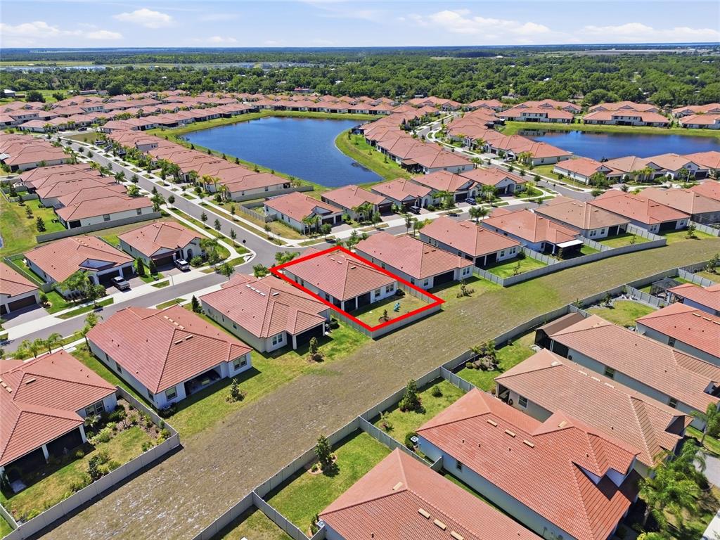 17301 Scuba Crest Street Wimauma, FL 33598 - Photo 25 of 37 an aerial view of residential houses with outdoor space and river