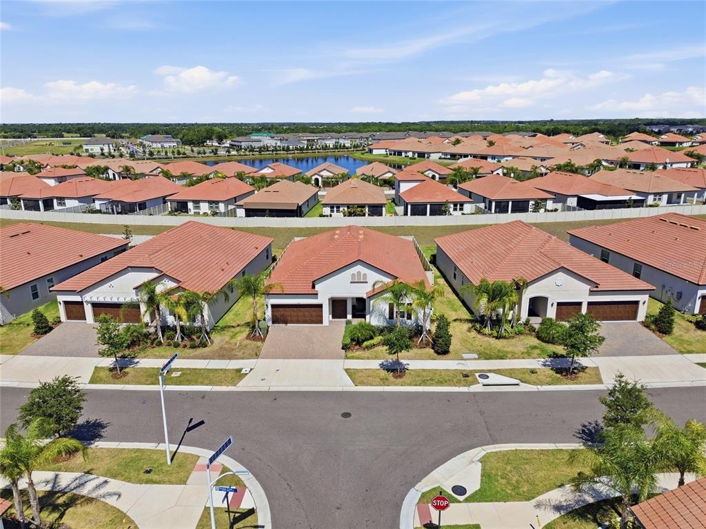 17301 Scuba Crest Street Wimauma, FL 33598 - Photo 27 of 37 an aerial view of residential houses and outdoor space