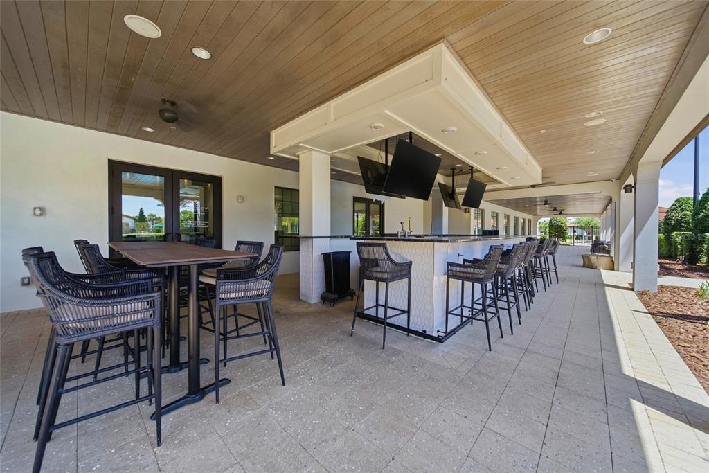 17301 Scuba Crest Street Wimauma, FL 33598 - Photo 35 of 37 a dining room with furniture and a view of kitchen