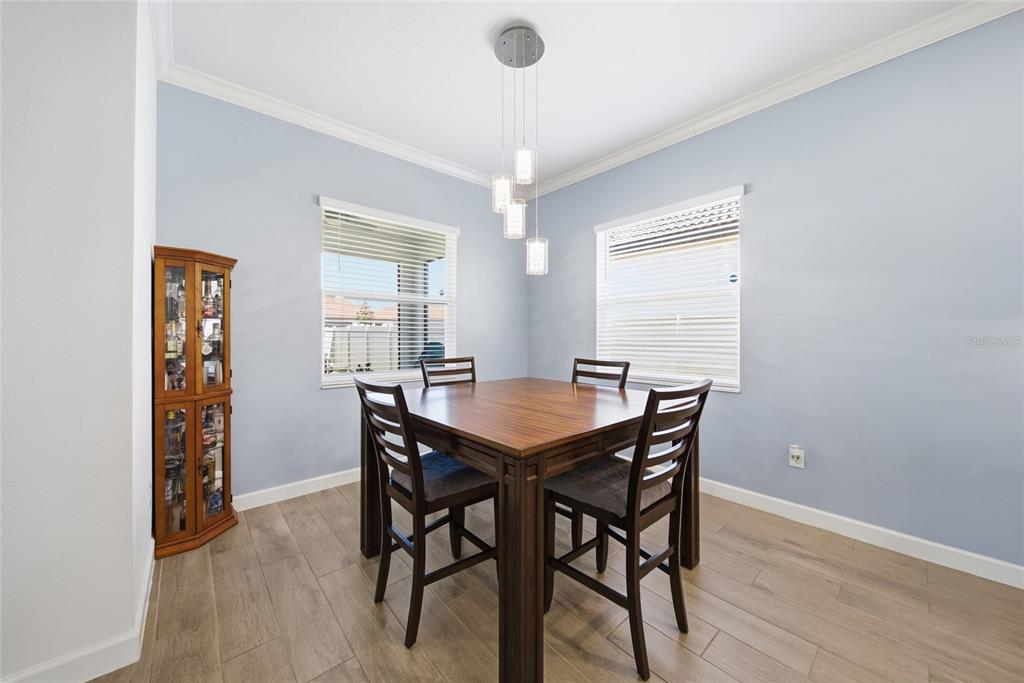 17301 Scuba Crest Street Wimauma, FL 33598 - Photo 8 of 37 a dining room with furniture and window