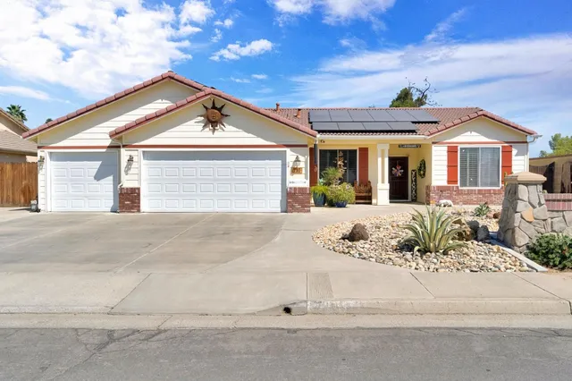 a view of a white house with a outdoor space