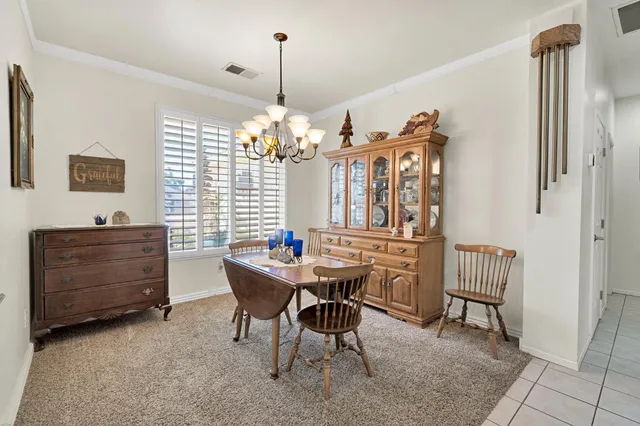 a view of a room with furniture and window