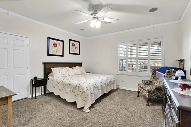 a spacious bedroom with a bed and a table