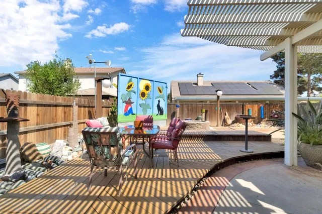 a view of a dining room with furniture wooden floor and a rug