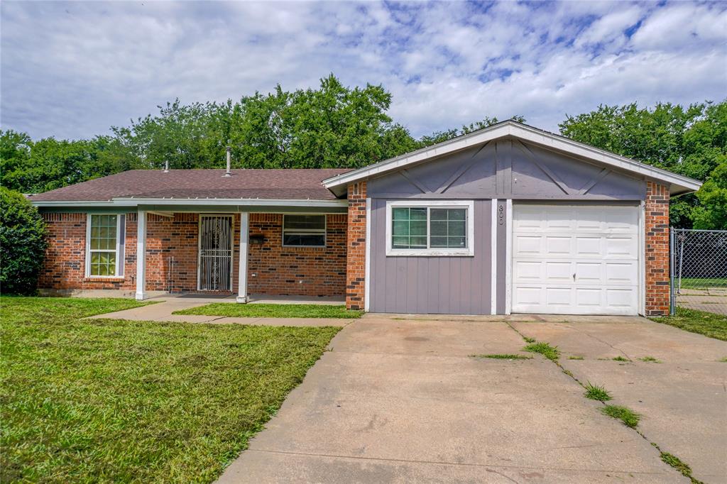 300 Coury Road Everman, TX 76140 - Photo 2 of 29 a front view of a house with a garden