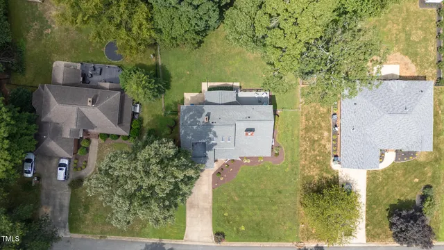 an aerial view of a house with outdoor space