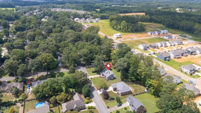 an aerial view of a house with outdoor space pool patio and outdoor seating