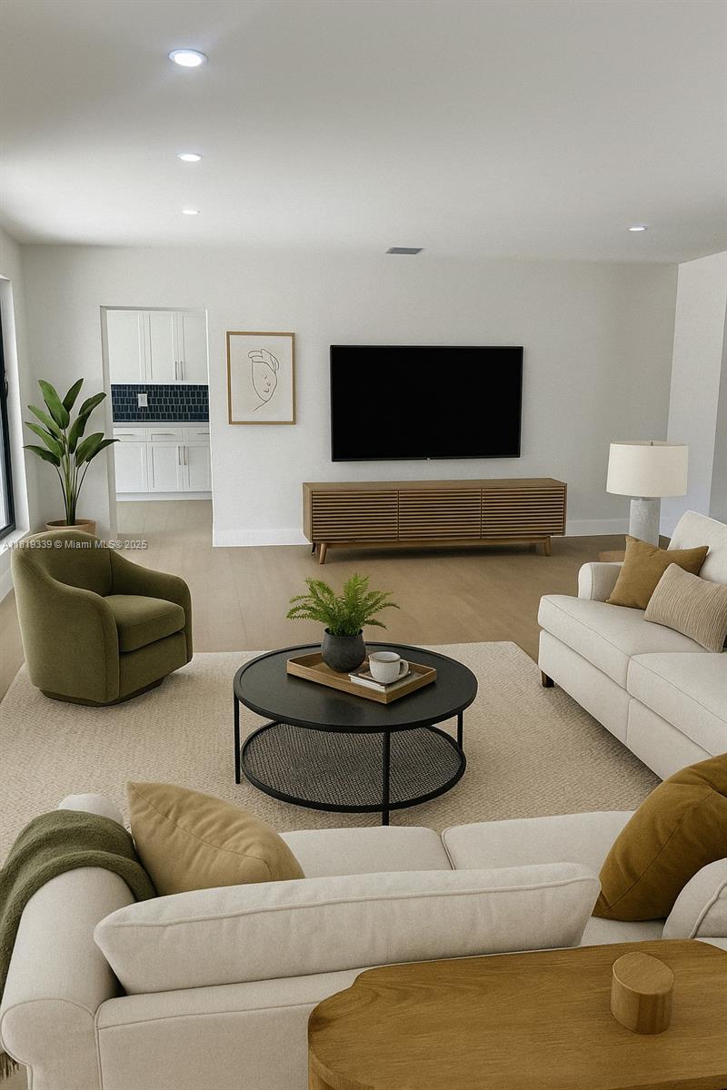Westchester Miami, FL 33165 - Photo 13 of 25 a living room with furniture and a flat screen tv