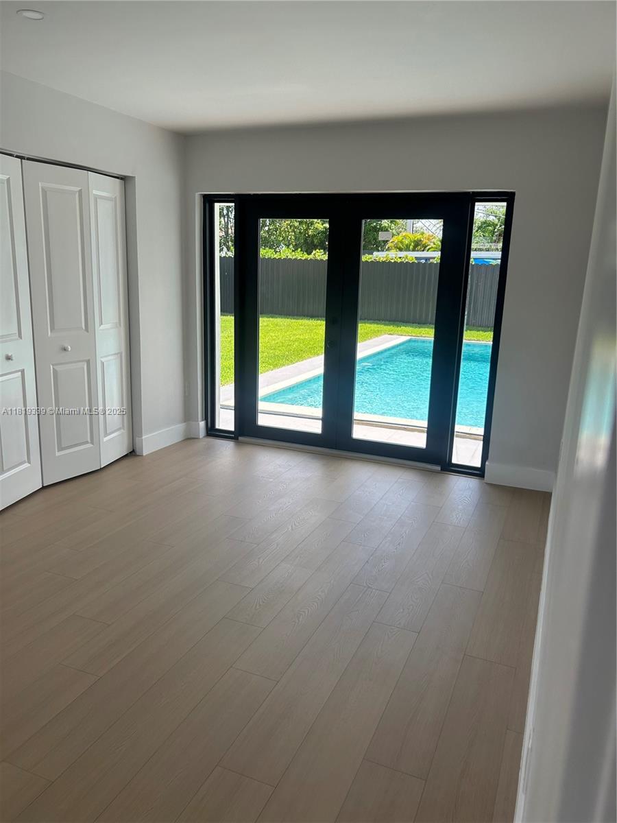 Westchester Miami, FL 33165 - Photo 15 of 25 an empty room with an outdoor view and a window