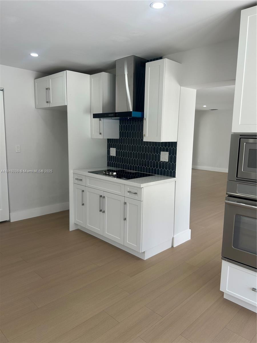 Westchester Miami, FL 33165 - Photo 2 of 25 a kitchen with stainless steel appliances a sink stove and refrigerator