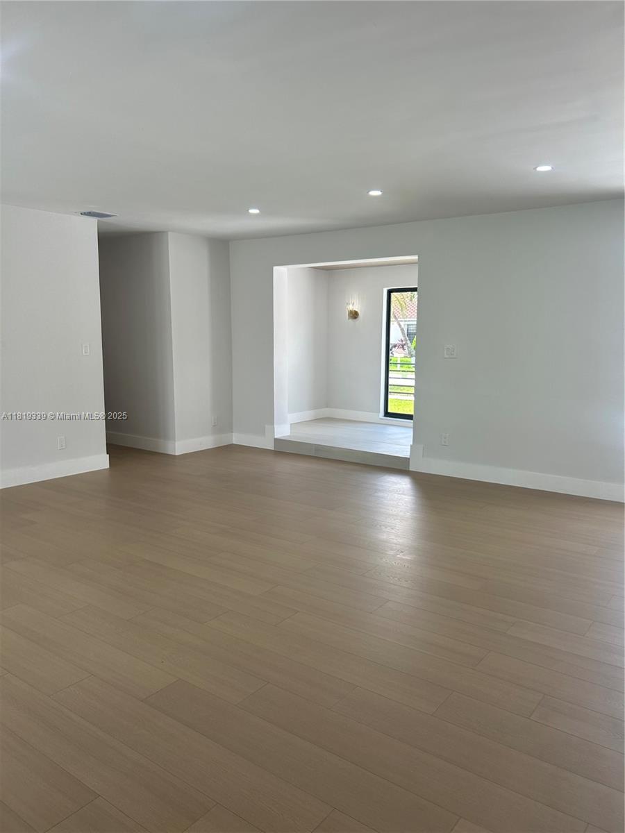 Westchester Miami, FL 33165 - Photo 21 of 25 a view of an empty room with wooden floor and a window