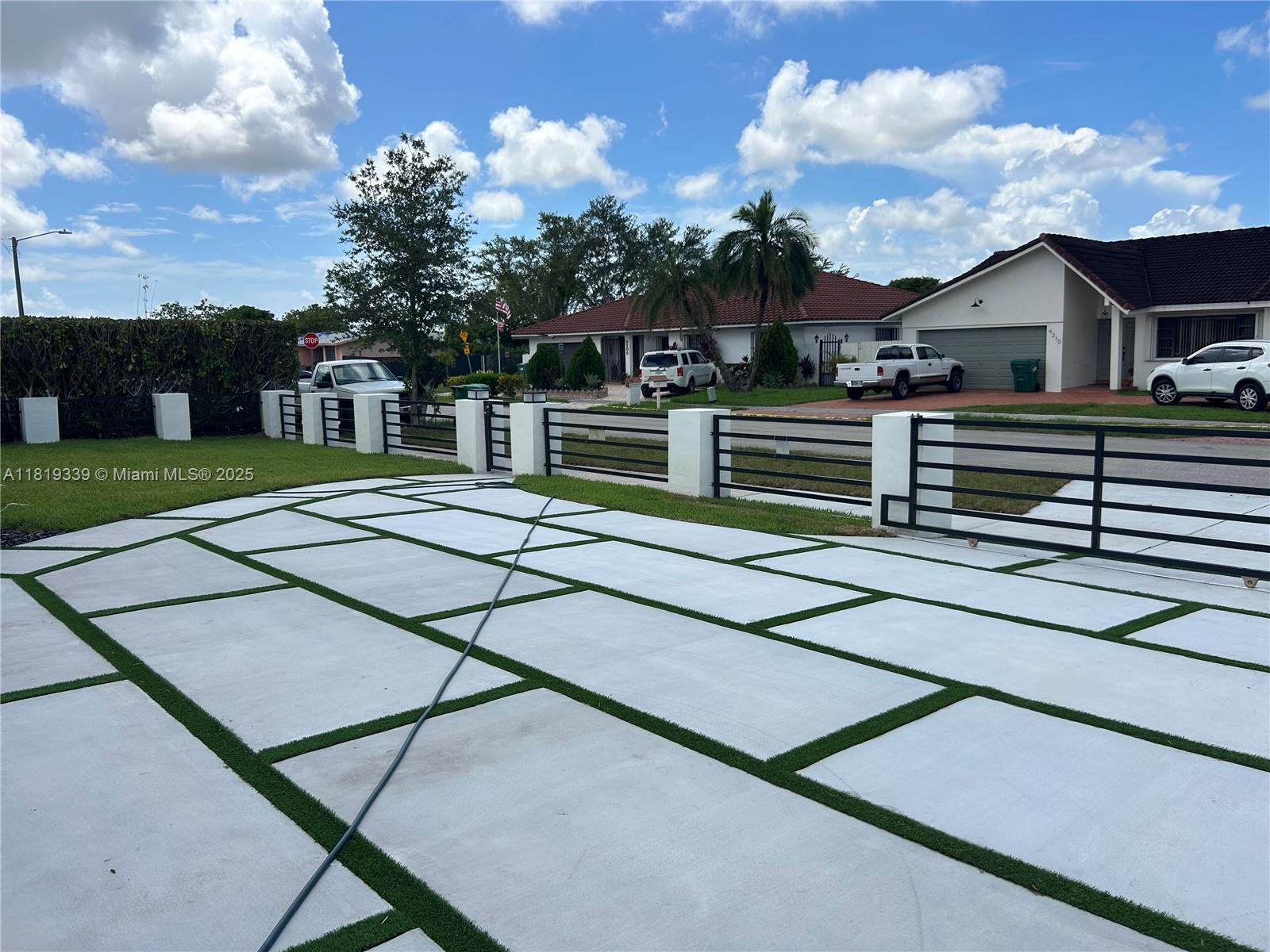Westchester Miami, FL 33165 - Photo 24 of 25 a view of a house with a backyard