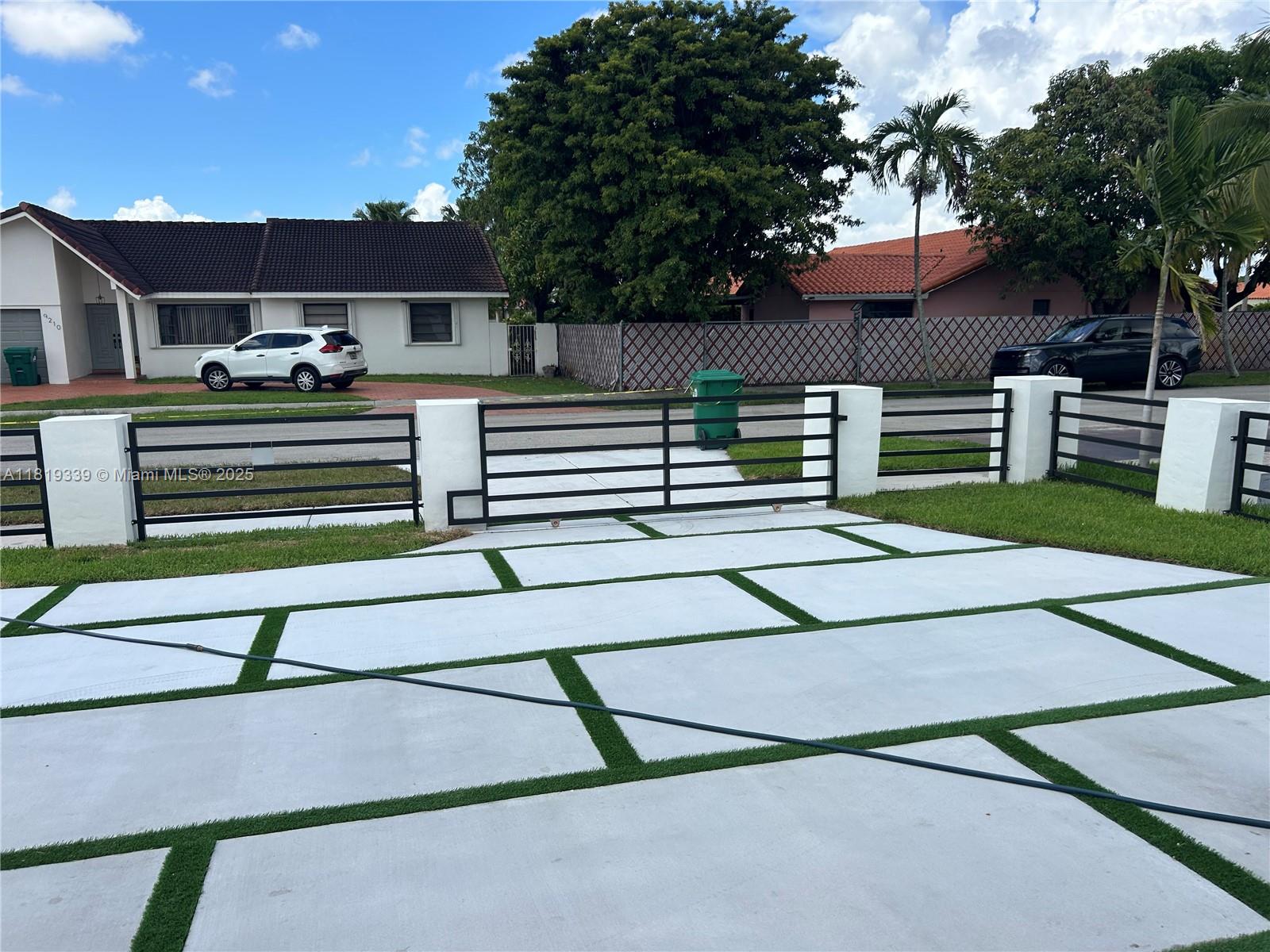 Westchester Miami, FL 33165 - Photo 6 of 25 a backyard of a house with barbeque oven and outdoor seating