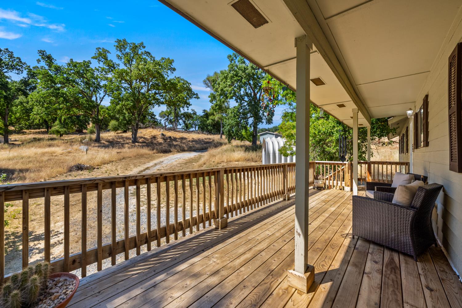 2162 Painted Pony Road Somerset, CA 95684 - Photo 5 of 65 a view of balcony with wooden floor and outdoor seating