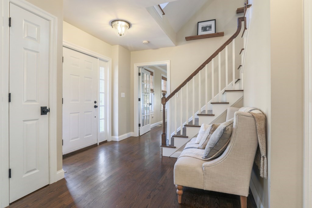6 Kate's Lane Boxford, MA 01921 - Photo 15 of 36 a view of a hallway with wooden floor stairs and a livingroom view