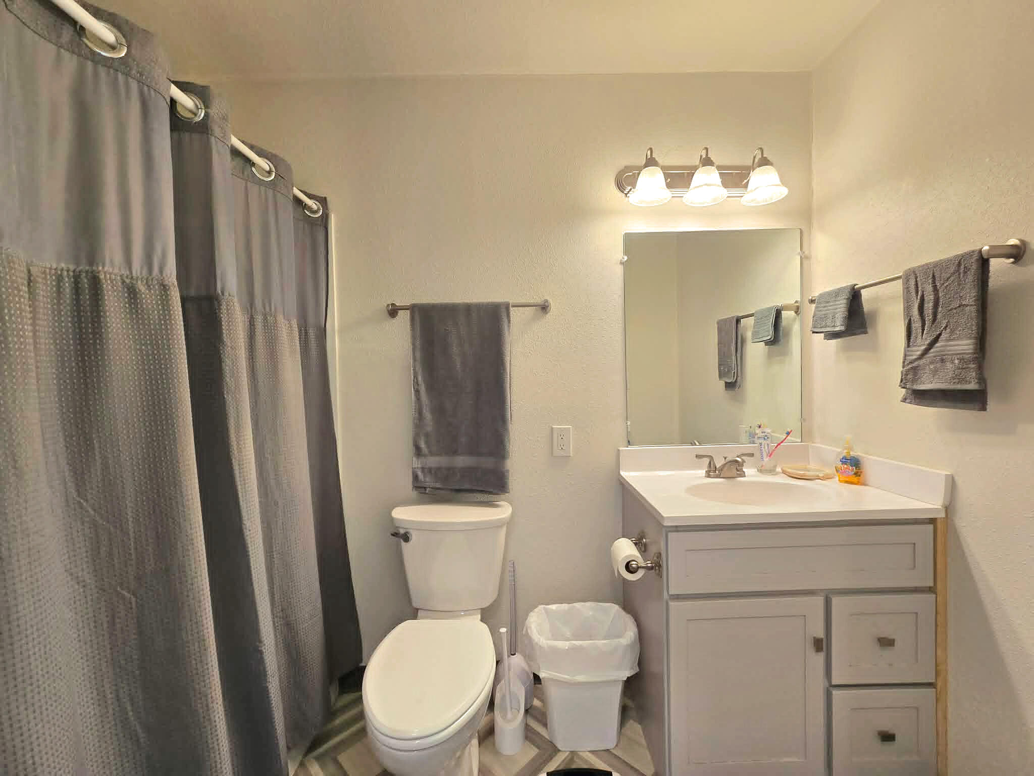 836 Ulrich Road Prospect, OR 97536 - Photo 27 of 47 a bathroom with a toilet sink vanity and mirror