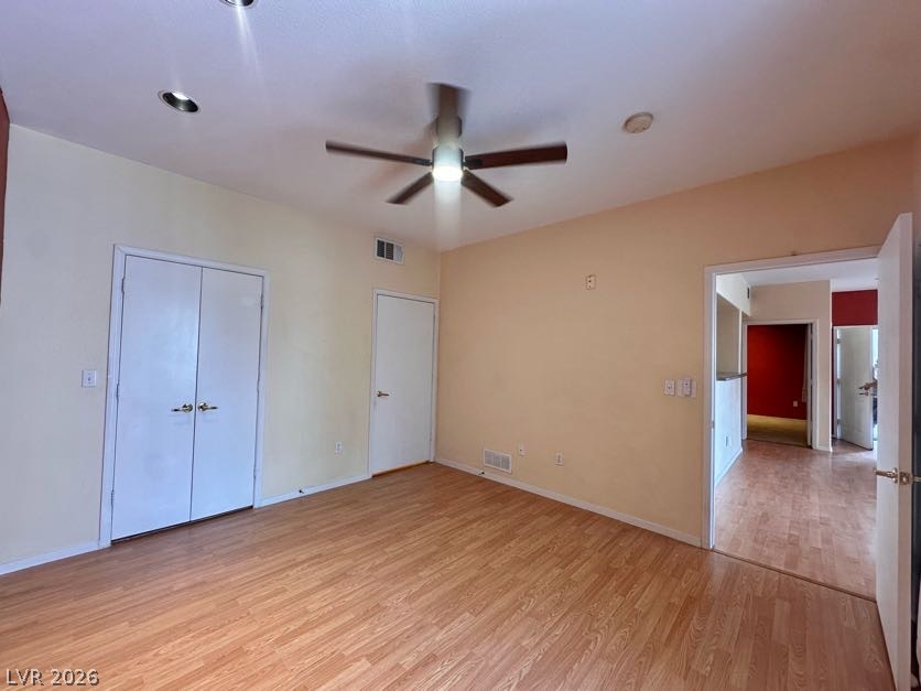 7255 West Sunset Road, Unit 1027 Las Vegas, NV 89113 - Photo 13 of 25 A versatile living space with light wood flooring and modern ceiling fixtures.