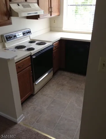 a kitchen with a stove and a microwave
