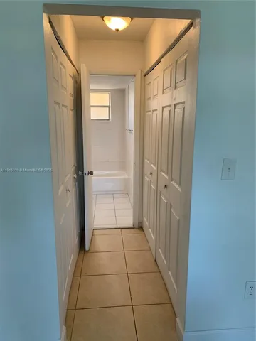 a bathroom with a shower and a sink