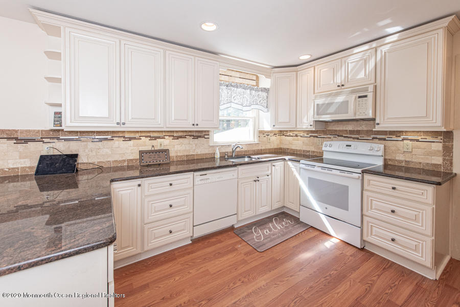 674 Burke Road Jackson, NJ 08527 - Photo 3 of 32 a kitchen with appliances cabinets and a sink