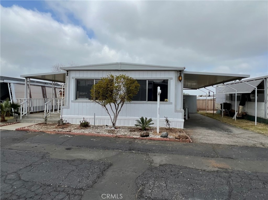 950 California Street, Unit 22 Calimesa, CA 92320 - Photo 1 of 1 a view of a porch with yard