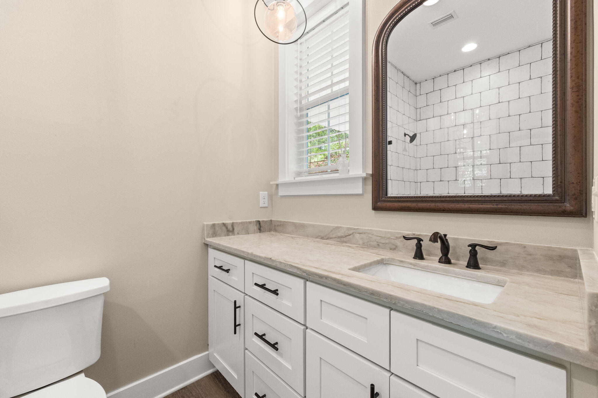 102 Churchill Drive Santa Rosa Beach, FL 32459 - Photo 54 of 89 a bathroom with a granite countertop sink a toilet and a mirror