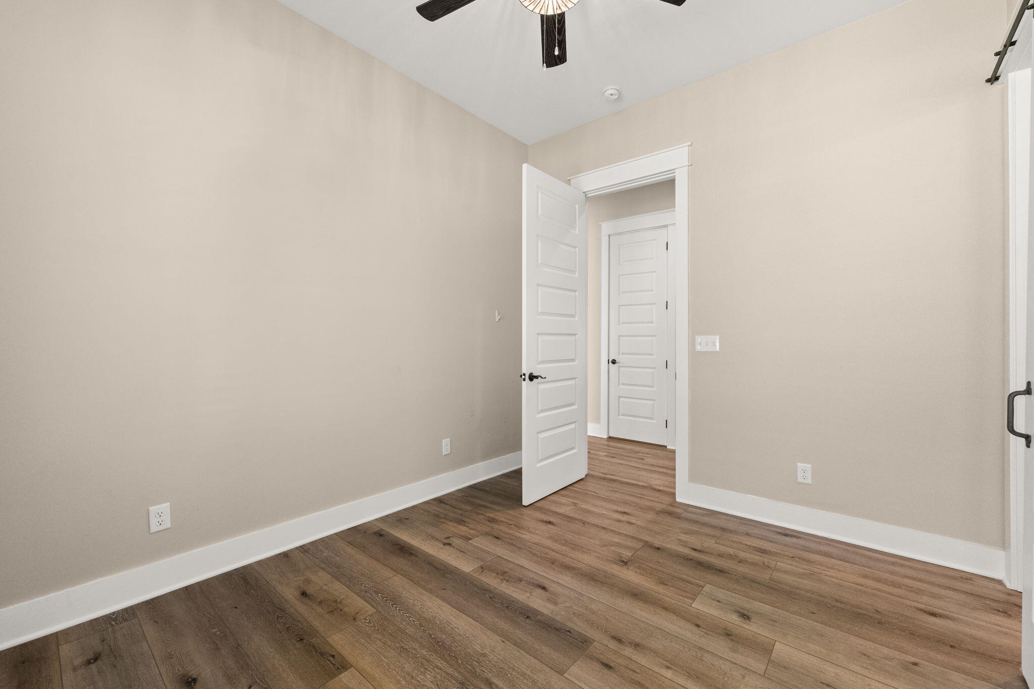 102 Churchill Drive Santa Rosa Beach, FL 32459 - Photo 56 of 89 a view of an empty room with wooden floor