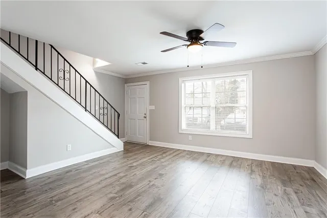 a view of an entryway with wooden floor