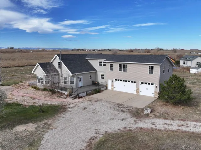 an aerial view of a house with a space and balcony