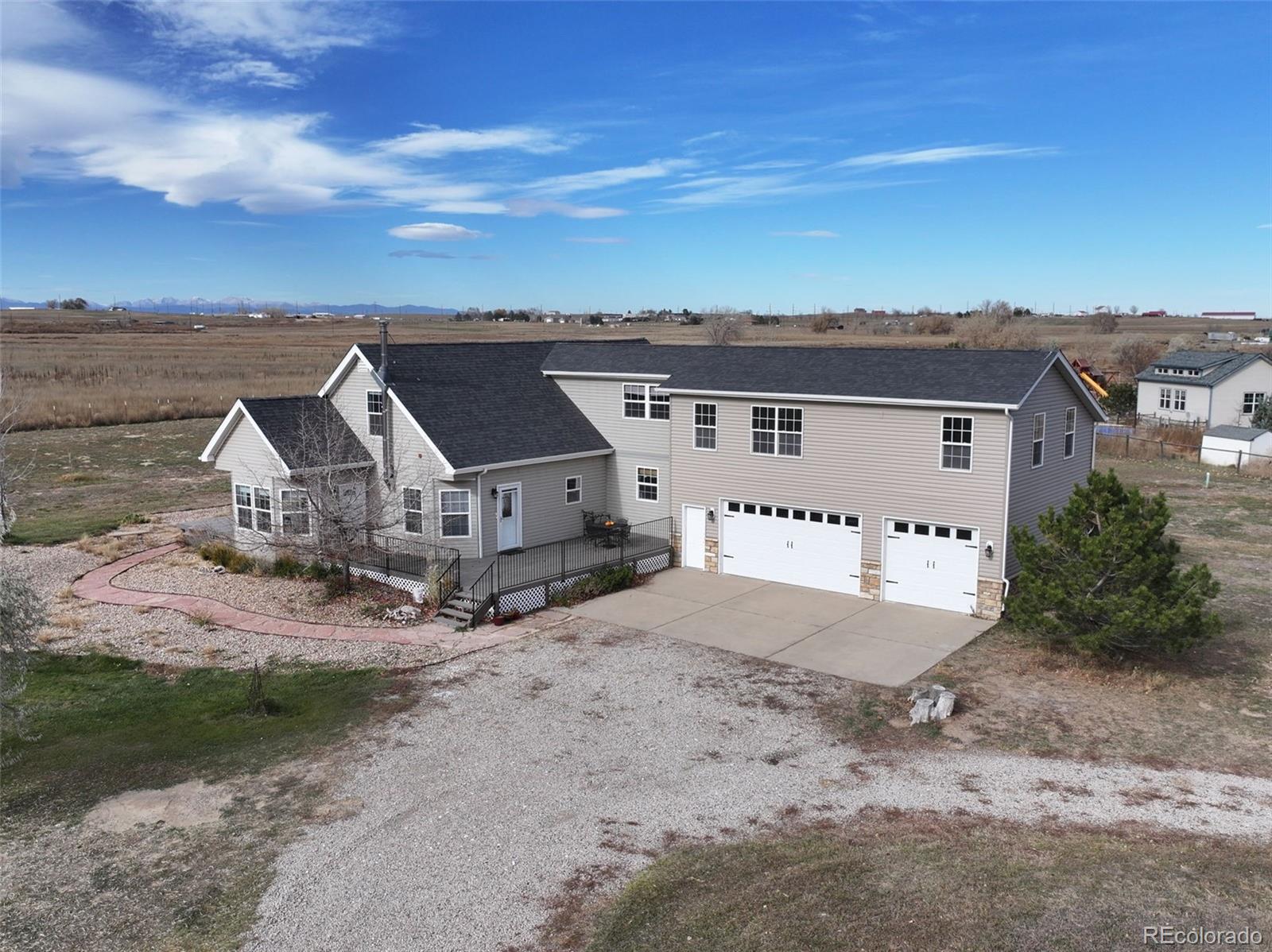 an aerial view of a house with a space and balcony