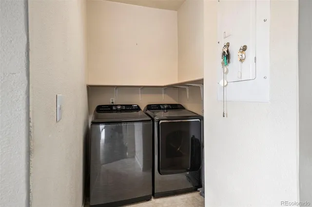 a close view of a utility room with washer and dryer