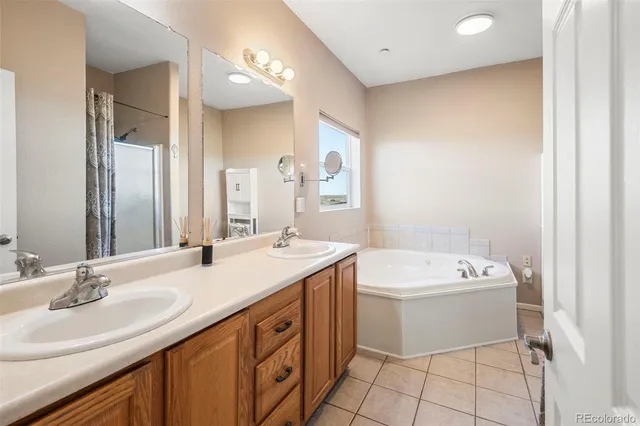 a bathroom with a sink a toilet a mirror and vanity