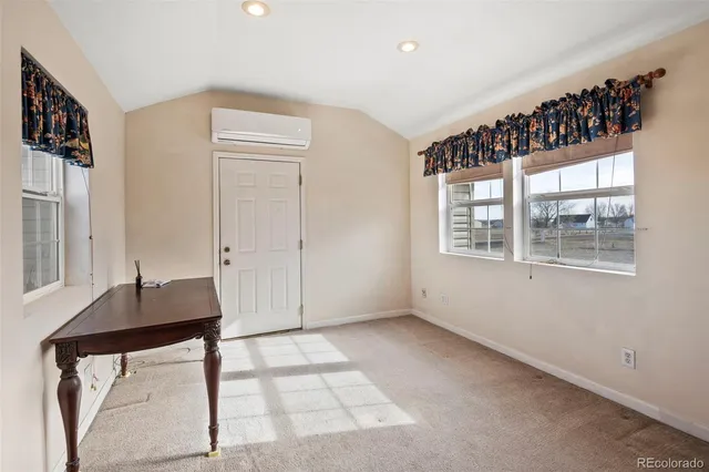 a view of livingroom with furniture and windows