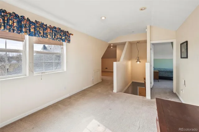 a view of a big room with windows