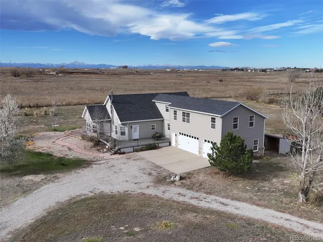 an aerial view of a house with a garden