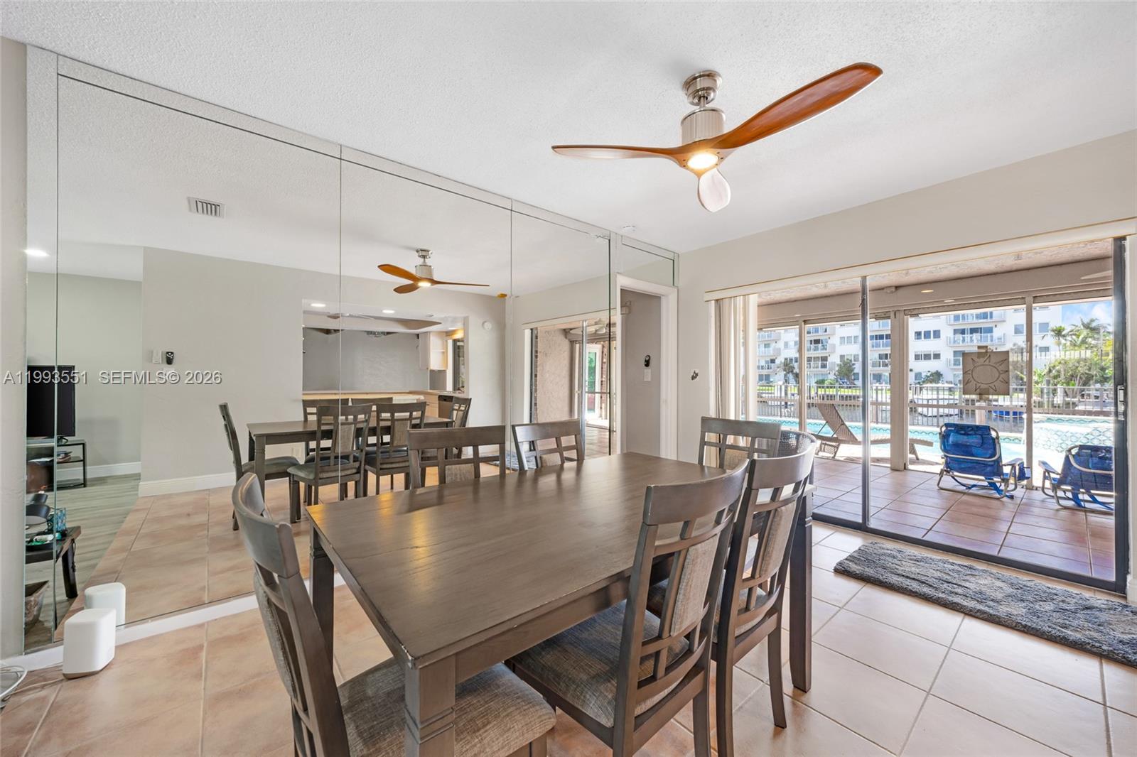 2752 Northeast 3rd Street Pompano Beach, FL 33062 - Photo 13 of 45 a dining room with furniture window and outside view