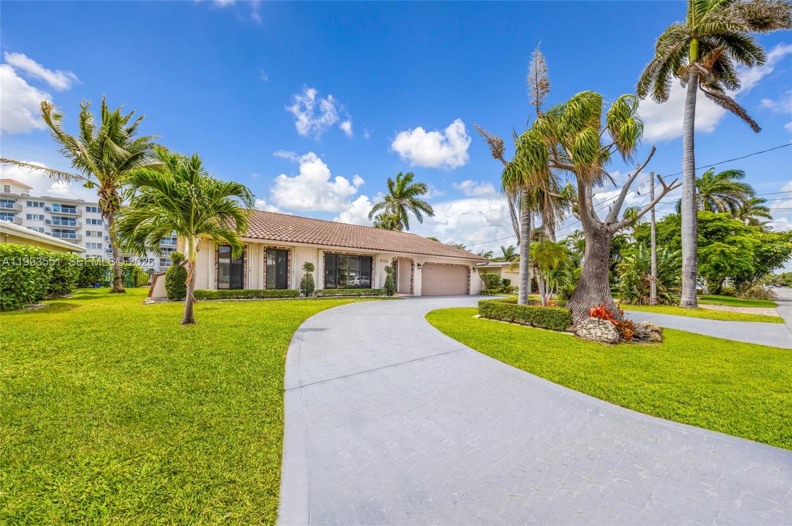 2752 Northeast 3rd Street Pompano Beach, FL 33062 - Photo 35 of 45 a front view of a house with garden
