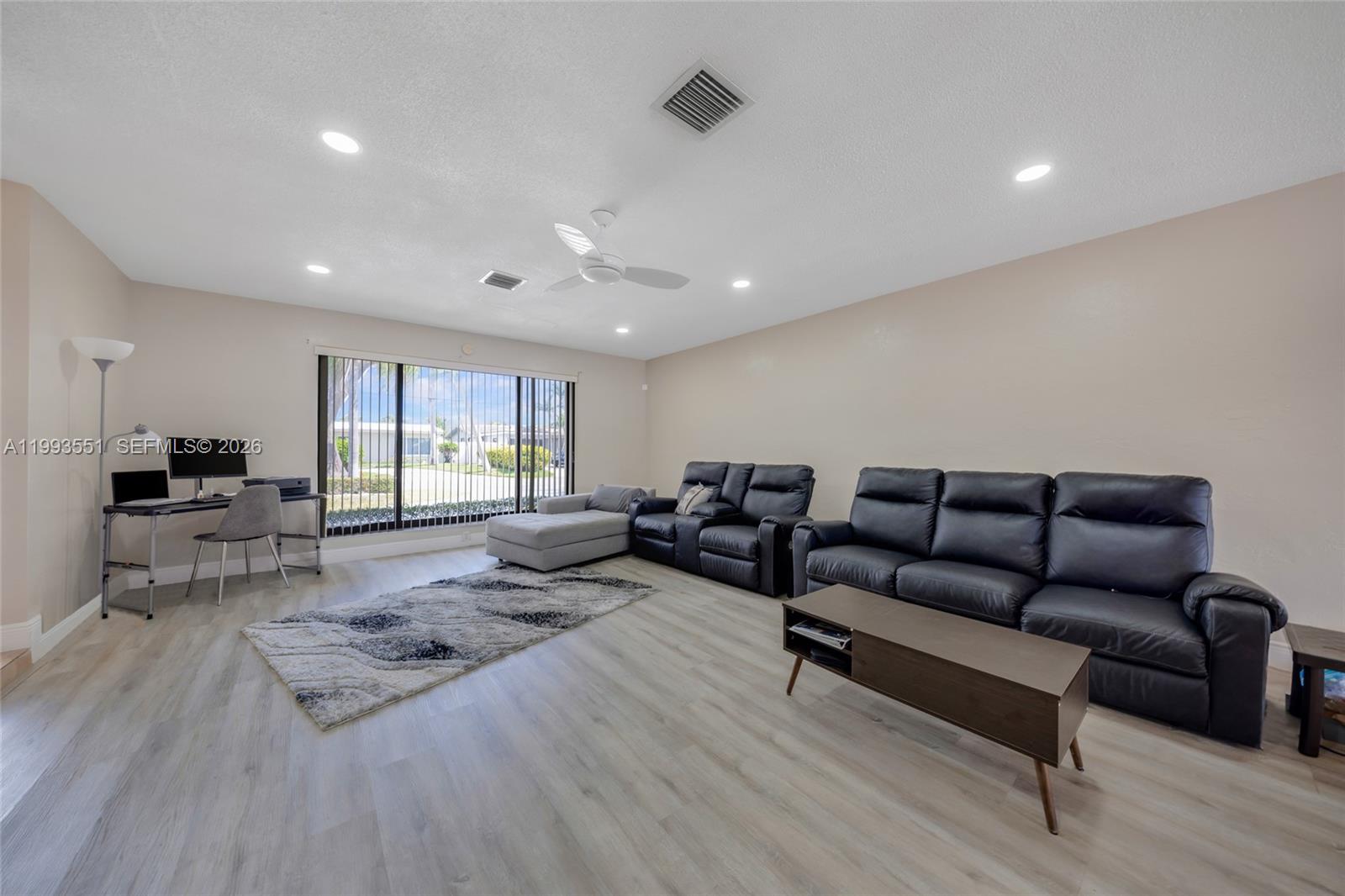 2752 Northeast 3rd Street Pompano Beach, FL 33062 - Photo 7 of 45 a living room with furniture and a wooden floor