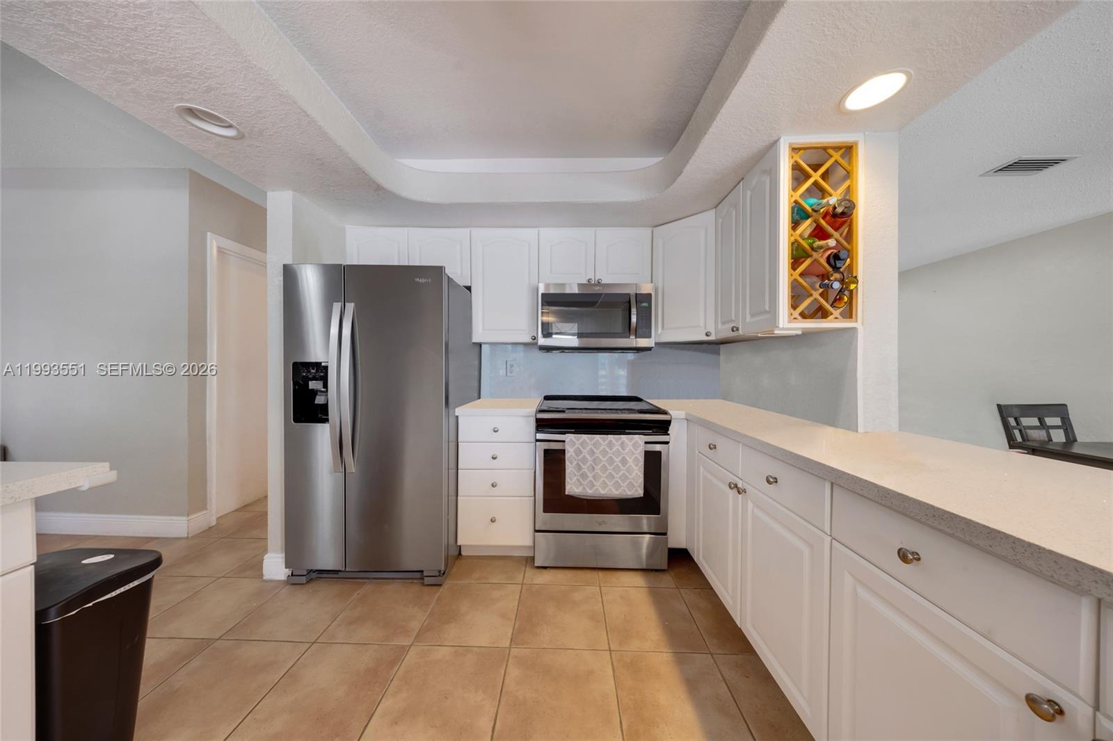 2752 Northeast 3rd Street Pompano Beach, FL 33062 - Photo 9 of 45 a kitchen with a refrigerator and a sink