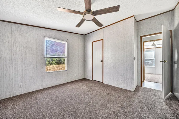 a large bathroom with a tub shower and sink
