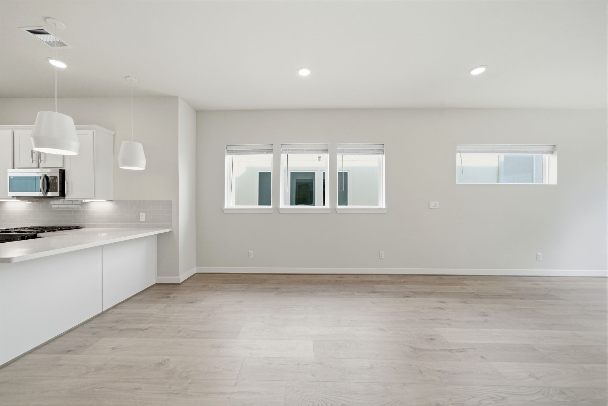 3073 Hicks Street Houston, TX 77007 - Photo 11 of 33 a kitchen with granite countertop a sink stainless steel appliances and cabinets