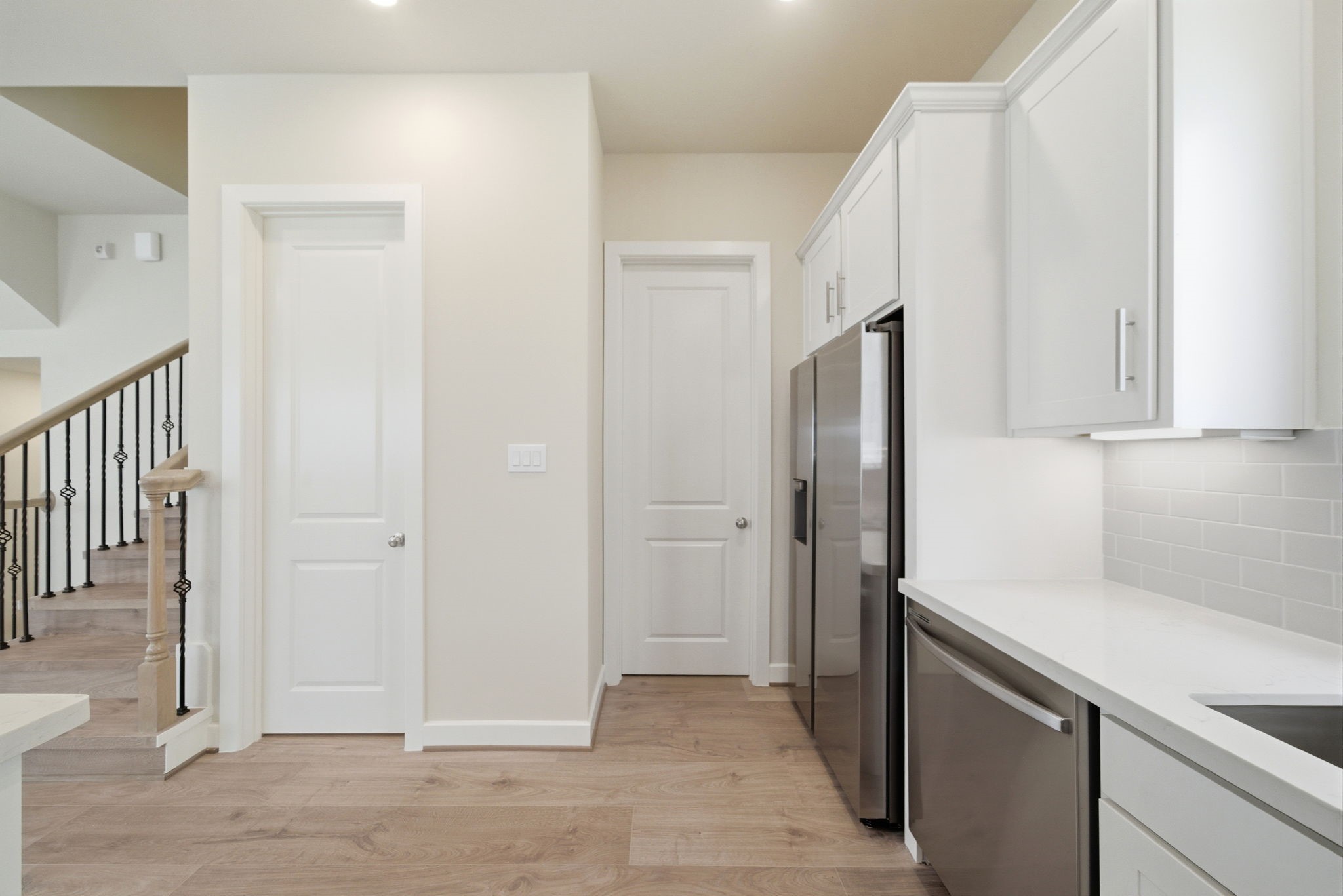 3073 Hicks Street Houston, TX 77007 - Photo 14 of 33 a view of a kitchen with white cabinets and refrigerator