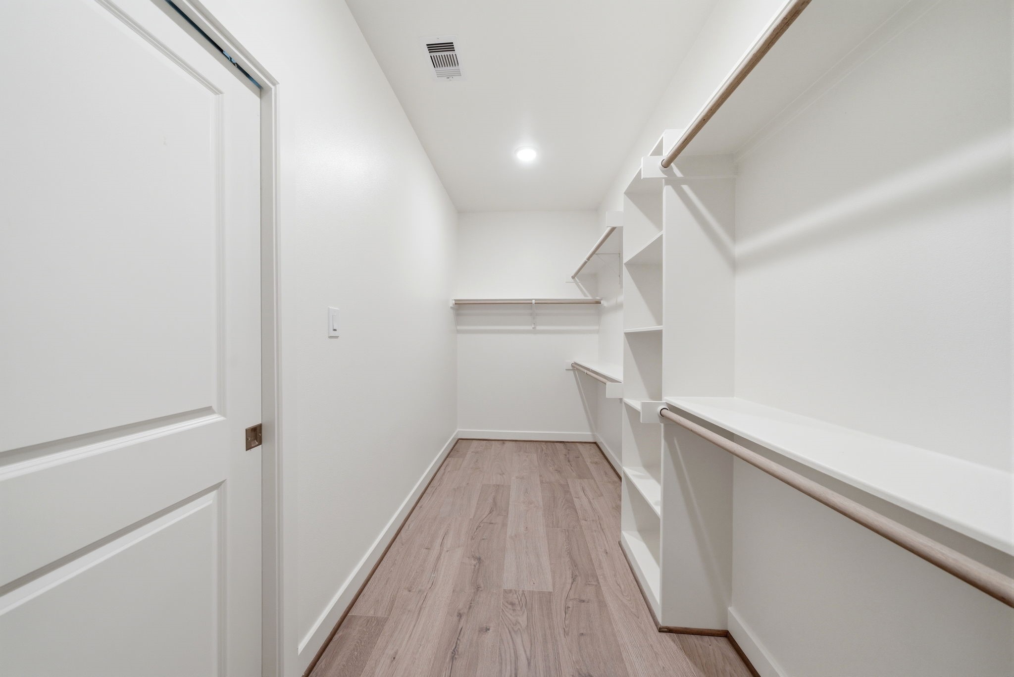 3073 Hicks Street Houston, TX 77007 - Photo 19 of 33 a view of hallway with stairs and wooden floor