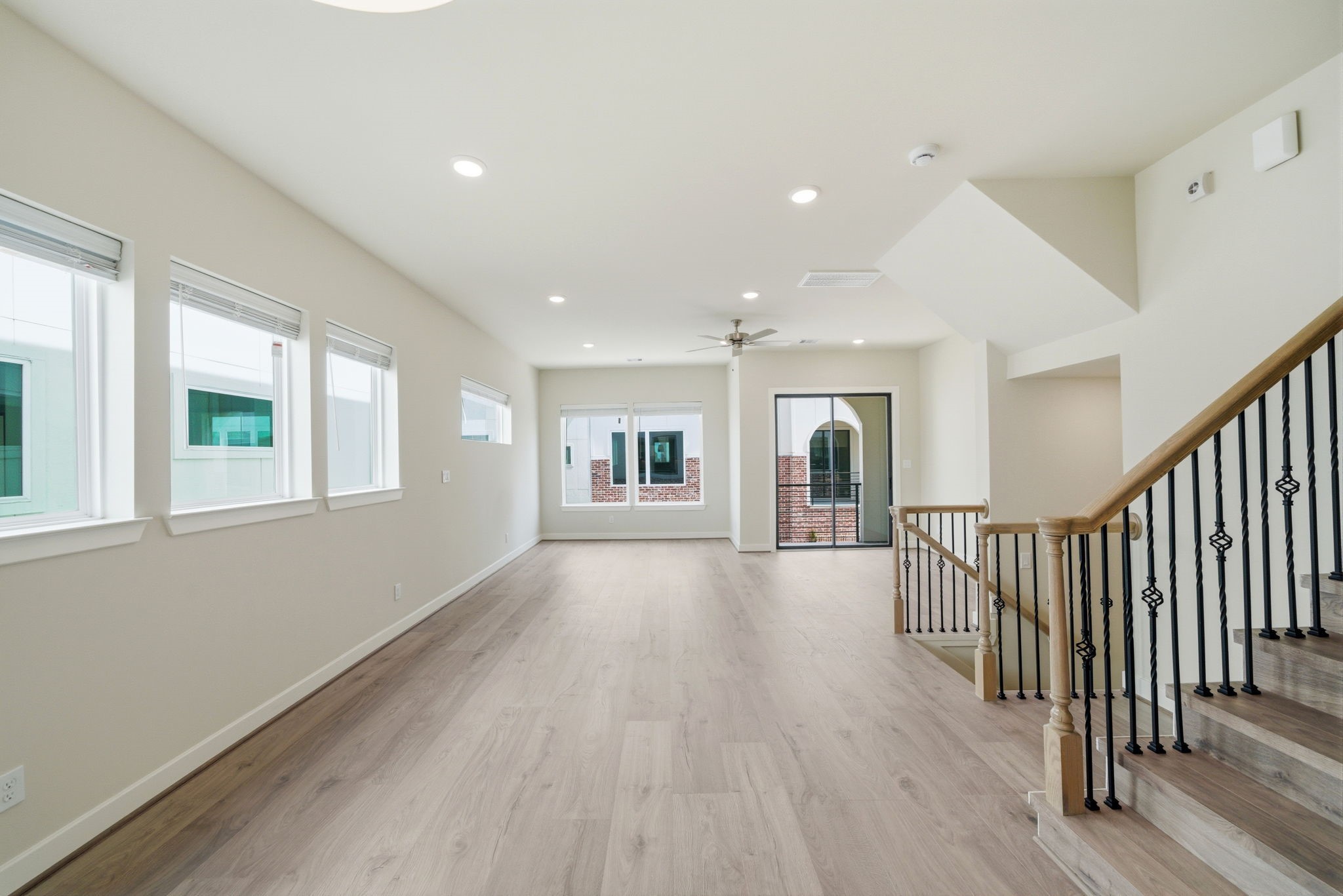 3073 Hicks Street Houston, TX 77007 - Photo 33 of 33 a view of a hallway with wooden floor and windows