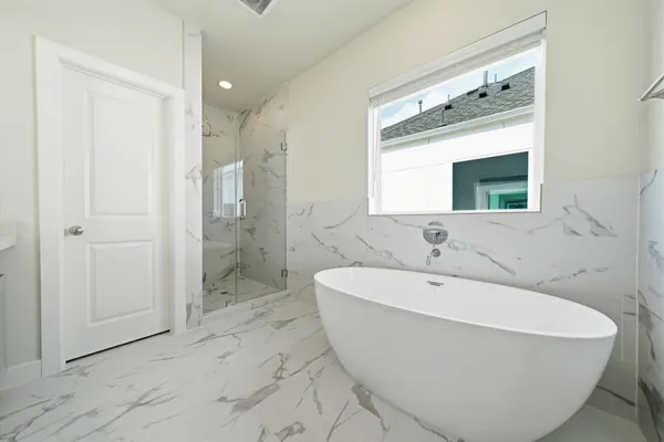 a spacious bathroom with a double vanity sink mirror and double