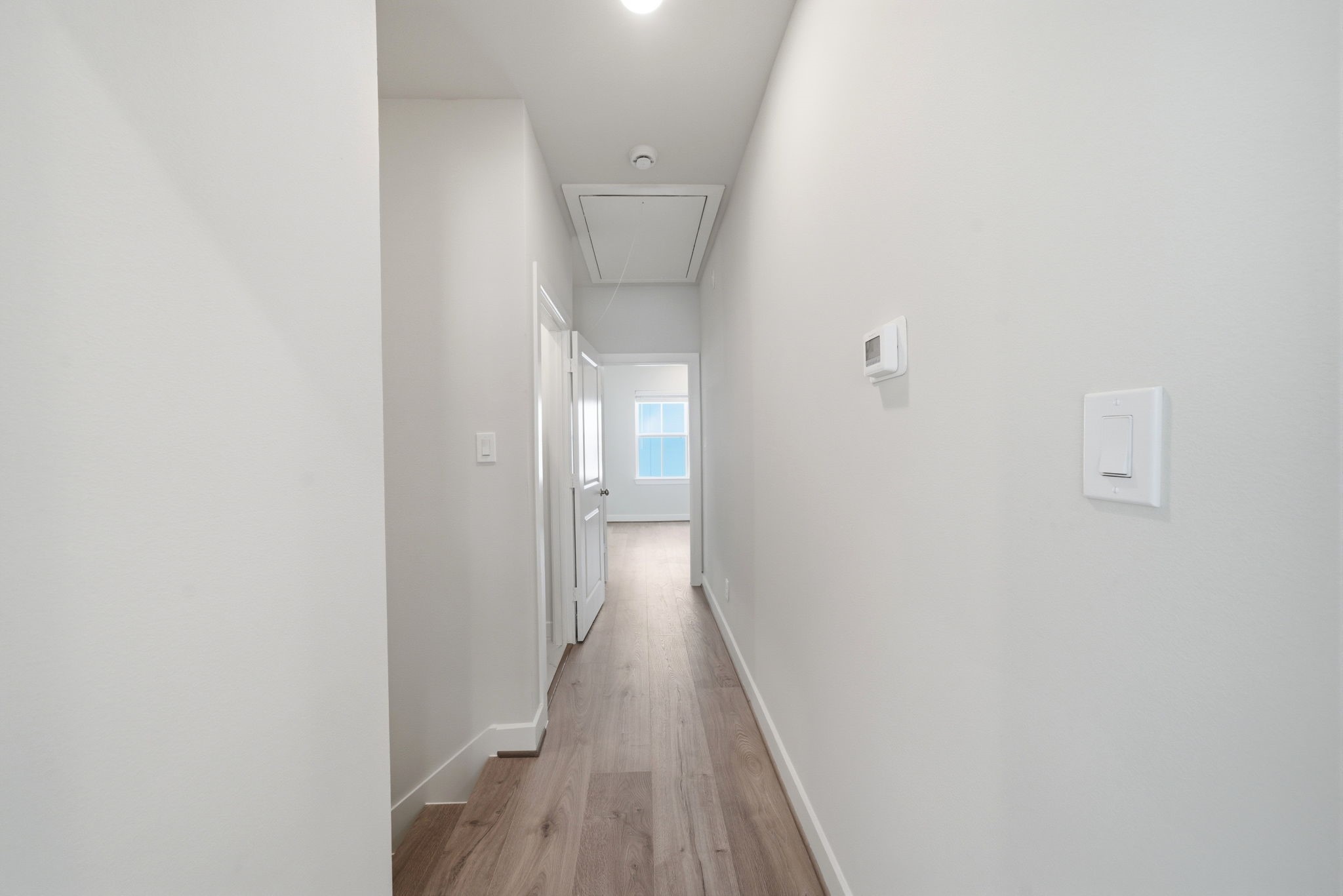 3073 Hicks Street Houston, TX 77007 - Photo 24 of 33 a view of a hallway with wooden floor