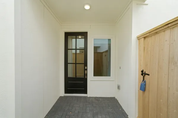 a view of a hallway with washer and dryer