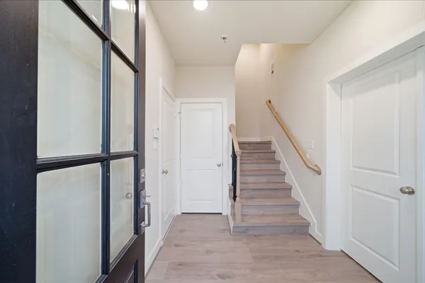 a kitchen with a sink and a mirror