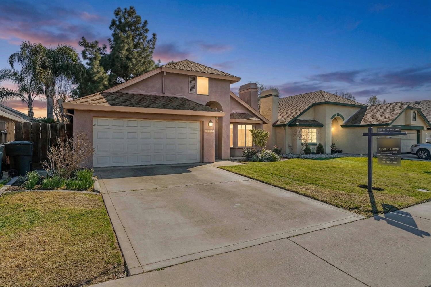 3668 Veneman Avenue North Modesto, CA 95356 - Photo 1 of 1 a front view of a house with a yard and garage